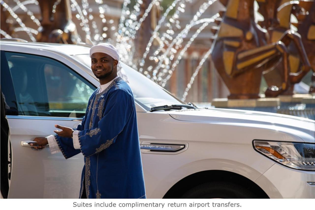 Jumeirah Dar Al Masyaf Dubai Exterior photo A hotel staff member opening a car door